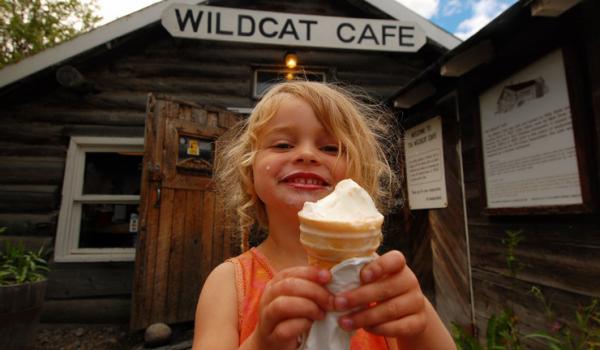 Wildcat Cafe young girl eating ice cream and smiling in Yellowknife. 